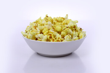 Tasty popcorn in a bowl on Dark Background. Snack for a movie