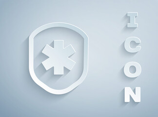 Obraz premium Paper cut Medical shield with cross icon isolated on grey background. Protection, safety, password security. Paper art style. Vector Illustration.