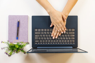 Female hand on a laptop, touchpad. remote work at the laptop. concept of Remote work or Freelance at the quarantine in the pandemic.