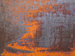 Rusty blue and orange painted detailed metal texture background. Close up view of grunge metal surface.