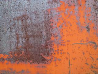 Rusty blue and orange painted detailed metal texture background. Close up view of grunge metal surface.
