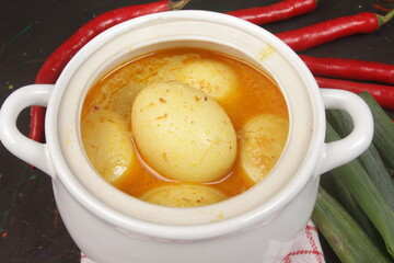 Fototapeta na wymiar telur opor or egg curry is traditional dish in indonesia
