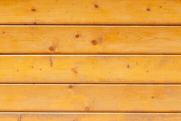 Naklejka premium Aged yellow painted wood wall from vertical planks. Background texture. Close up