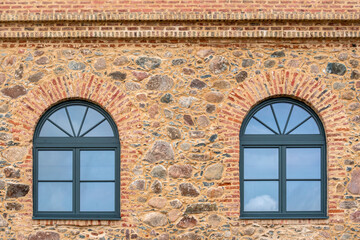 Modern windows in the old brick building