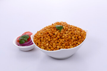 Fried Salted Chana Dal, White bowl on dark background, Chana Dal Masala is a popular Chakna recipe
