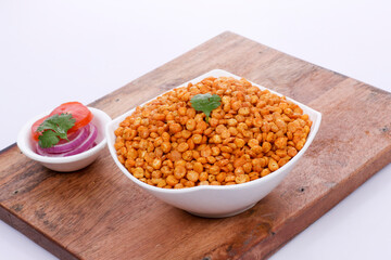 Fried and Spicy Chana Masala Dal, Chana Dal is a very popular Gujarati snack, white bowl on Wooden background