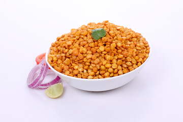 Fototapeta na wymiar Fried Salted Chana Dal, Snacks for every occasion, white bowl on white background, Chana Dal Masala is a popular Chakna recipe