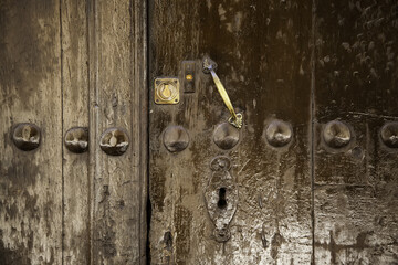 Old brown wooden door with lock