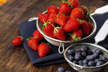 Fresh ripe strawberry and blueberry in bowl