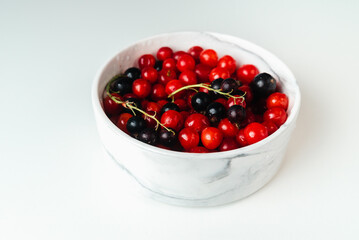 Cherries in marble plate Isolate on white background. Autumn harvest of berries.  Place for text