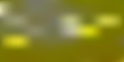 Light yellow vector abstract blur drawing.