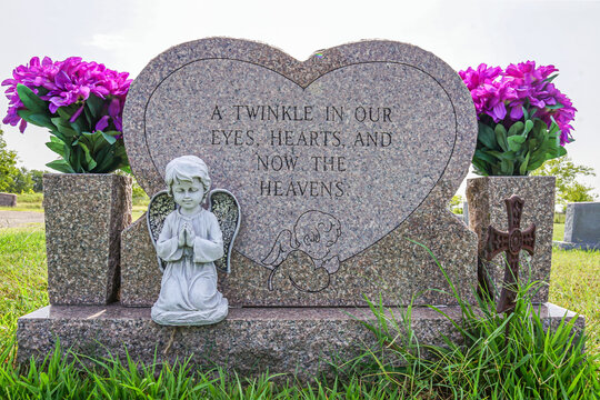 A gravestone and epitaph for a young child.