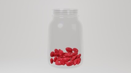 Transparent bottle for pills. Red gelatin translucent oval pills.
