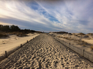 Sandy path at Cape Henlopen State Park, Lewes, DE, leading from the Atlantic Ocean to the lighthouse in the Delaware Bay © Maureen