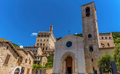 Fototapeta na wymiar Churches line the hill in the cathedral city of Gubbio, Italy in summer