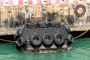 Ship's or marine fender at deep sea port for mooring the ship made from cylinder shape rubber and...