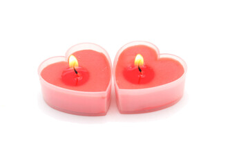 Obraz na płótnie Canvas Two valentine day love candle hearts isolated on white background, close-up.