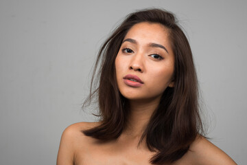 Fototapeta premium Portrait of young beautiful Asian woman shirtless