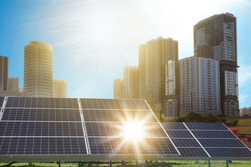 Fototapeta na wymiar Cityscape and solar panels installed outdoors. Alternative energy source