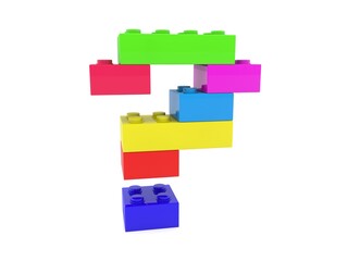 The question mark is made of different colored toy bricks on white