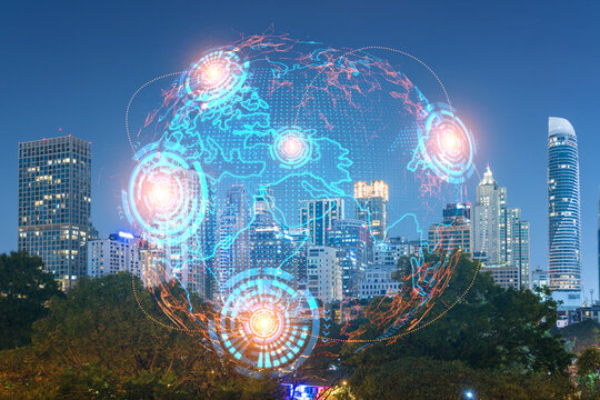 Multi exposure of Bangkok cityscape night time background and world map hologram. Concept of media networking.