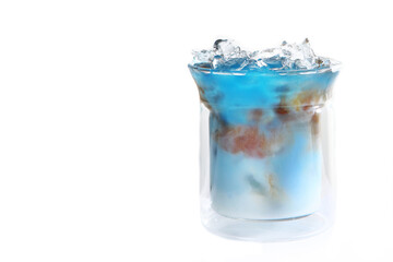 Blue matcha tea with milk and coffee in a glass Cup. soft drink. Light background. Copy of the space.
