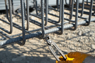 construction worker working in iron bending with pincers. Only hands