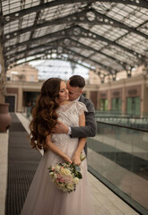 Fototapeta premium beautiful couple, bride and groom in long dress, part, wedding, girl with curvy hair