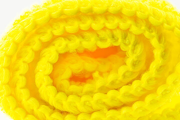 Background made of yellow curled microfiber material, front view, macro shot.