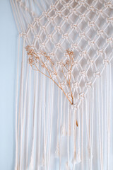 dry flowers on a white background with macrame, hand made with rope
