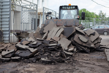 Road repair. Workers are laying asphalt.