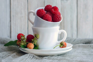 fresh raspberries in a white Cup