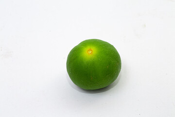 Green lemon on white background