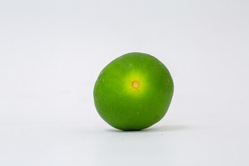 Green lemon on white background