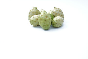 Noni or Genus Morinda fruit on white background