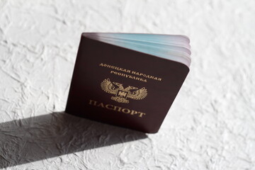 Passport of the Donetsk people's Republic on a white crumpled background. The inscription in Russian: Donetsk people's Republic, passport.