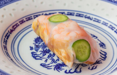 Traditional handmade vietnamese spring roll with prawns, egg and vegetables