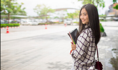 Portrait of smart, clever, woman  holding books, exercise books learning materials, importance of...