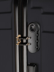 black plastic suitcase on wheels