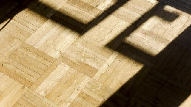 Sunlight and Shadows on Parquet Floor in Time Lapse