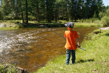 child fishing in the river