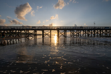 Fototapeta na wymiar sunrise at the pier and beach