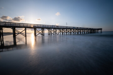 long exposure of the sunrise over the pier