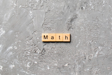 math word written on wood block. math text on table, concept
