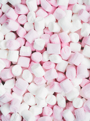 a lot of little pink and white marshmallows - food background