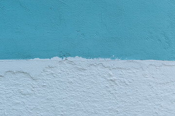 blue and white painted old concrete wall