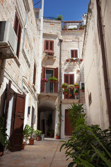Fototapeta na wymiar Typical architecture of Puglia and the small Mediterranean countries. Buildings built in stone.