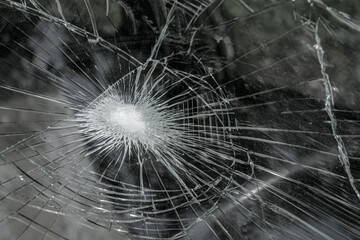 Broken glass window. Crushed windshield.