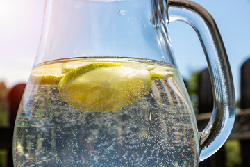 Homemade lime water in glass carafe