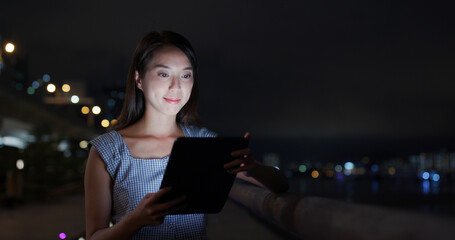 Woman use of tablet computer at outdoor